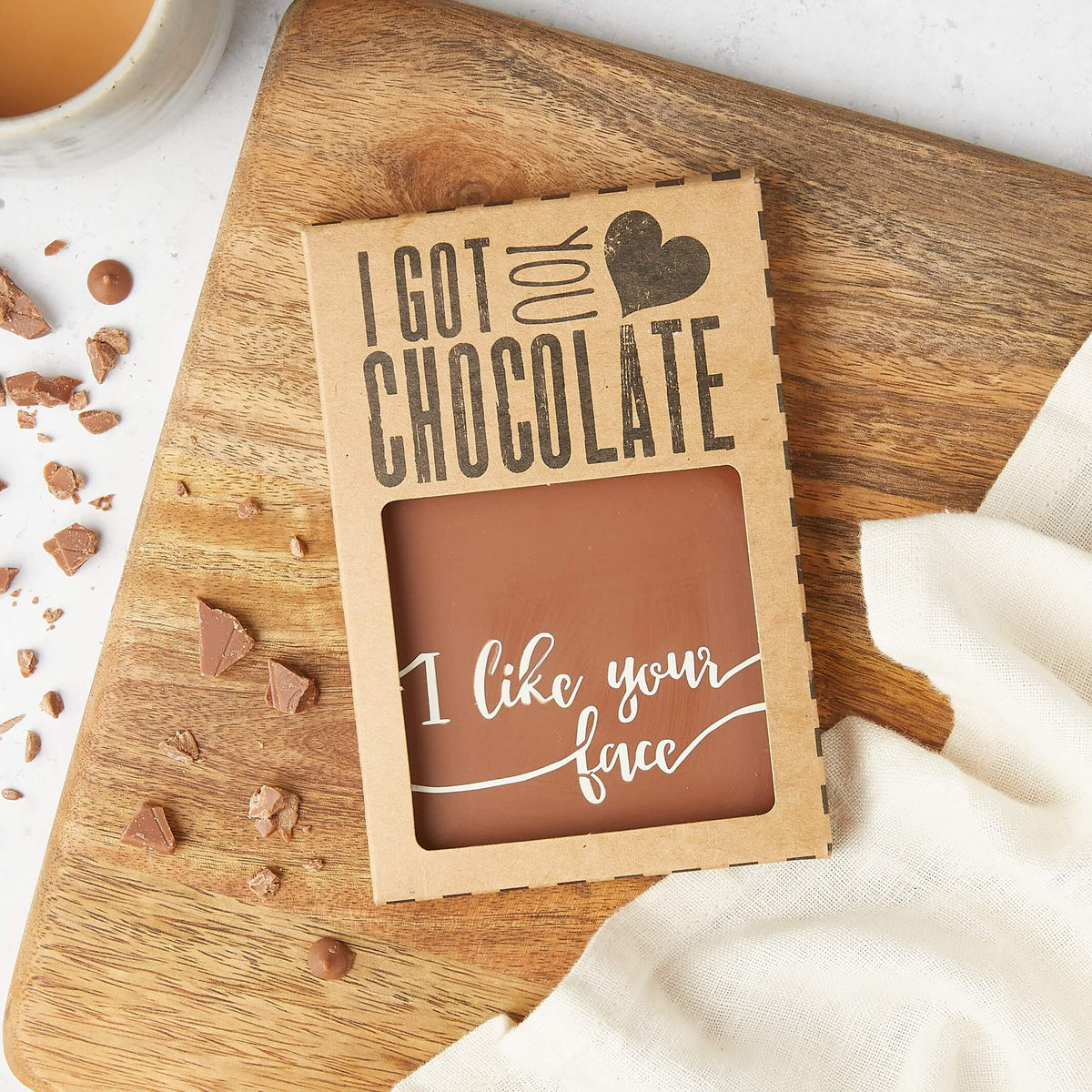 Milk Chocolate Gift - Chocolate bar in kraft gift packaging with “I like your face” visible through the box – part compliment, part delicious treat, fully charming.
