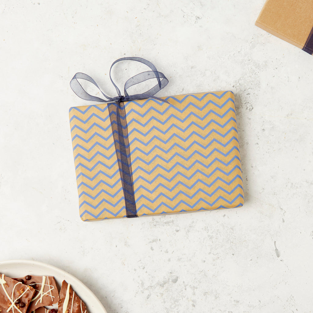Our standard Bagstock & Bumble kraft gift wrap with a blue chevron design and blue ribbon.  All our chocolates can be gift wrap and posted direct.