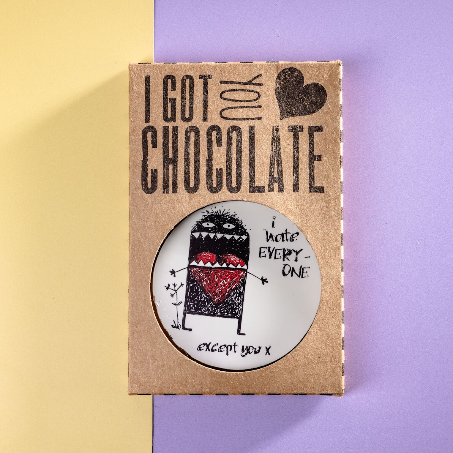 ‘I Got You Chocolate’ gift box with window revealing a cheeky chocolate disc featuring a monster illustration and anti-Valentine's slogan – a brilliant choice for chocolate gifts UK with a sarcastic twist.