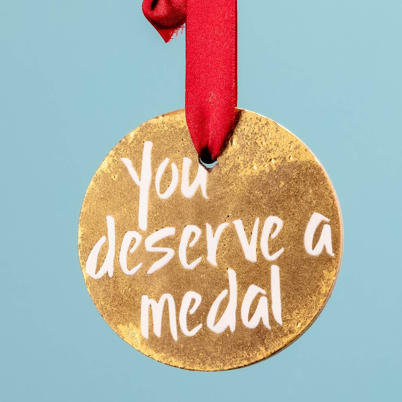 Chocolate congratulations medal – A handcrafted Belgian milk chocolate medal with a ribbon, perfect for celebrating achievements in the most delicious way.