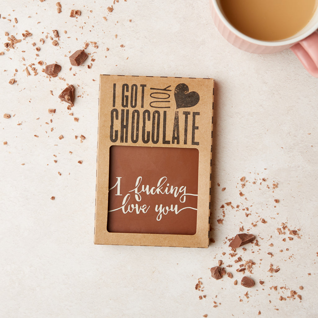 Custom kraft cardboard 'I got you chocolate' gift packaging containing an 'I fucking love you' chocolate bar