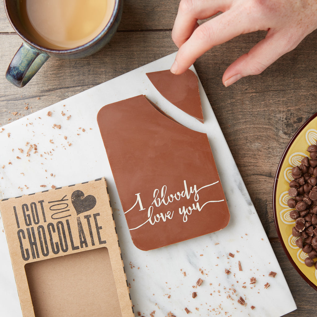 Handmade chocolate bar decorated with 'I bloody love you' text in coloured cocoa butter