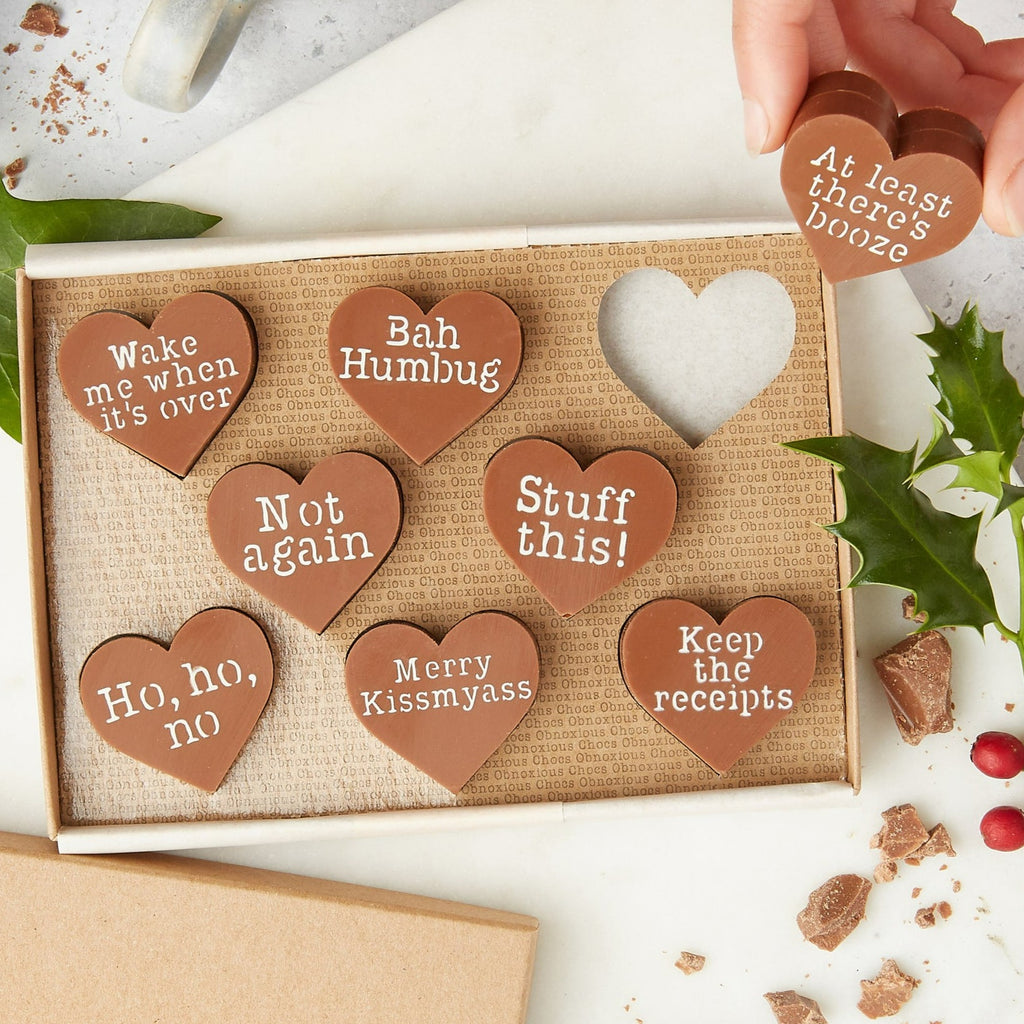 Eight milk chocolate hearts decorated with funny Christmas slogans and presented in an Obnoxious Chocs gift box.  The perfect Secret Santa gift for him.