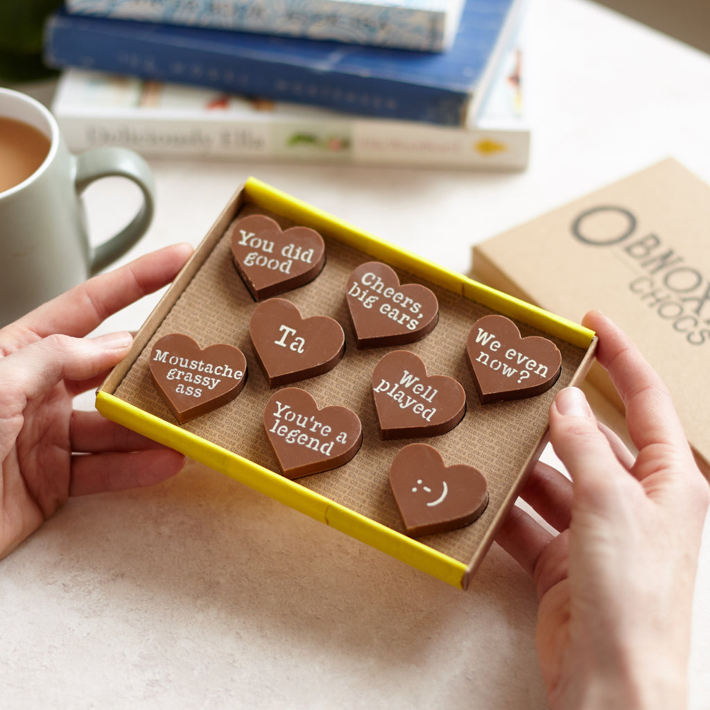 Selection of thank you chocolates with funny messages added to chunky milk chocolate hearts and presented in an Obnoxious Chocs gift box