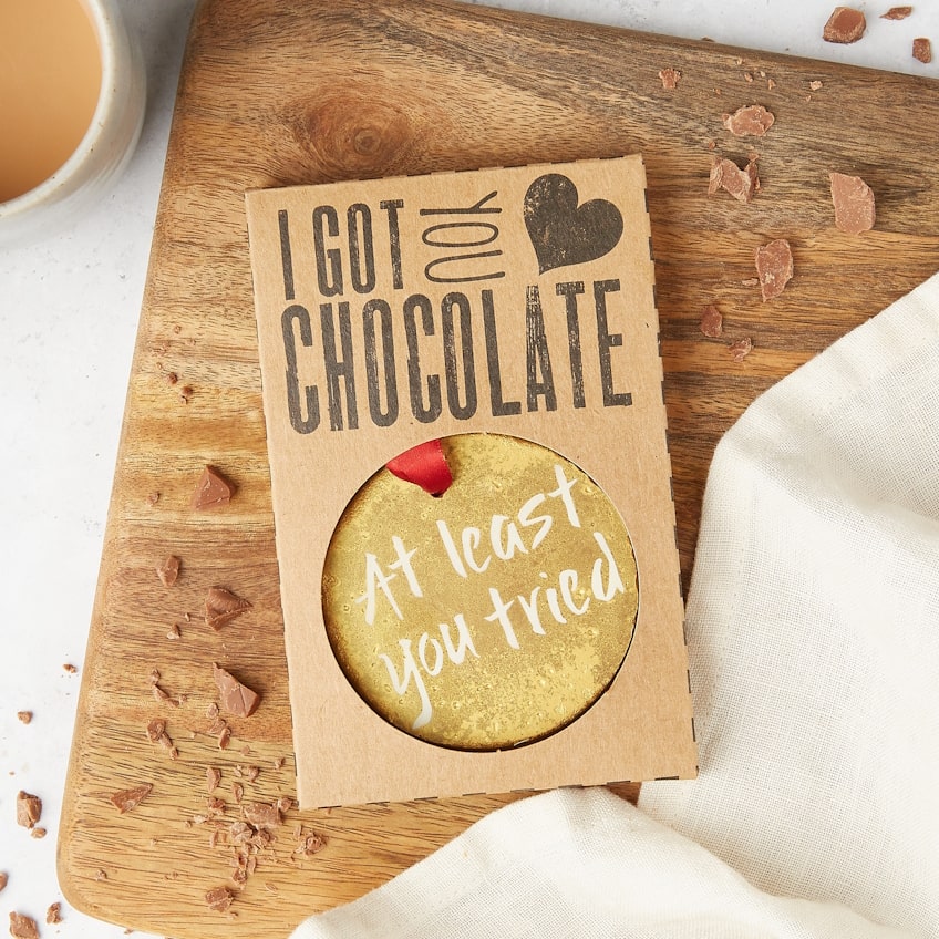 The chocolate medal presented in kraft ‘I Got You Chocolate’ packaging, message “At least you tried” showing through the window – a funny congrats option for almost-winners and loveable triers.