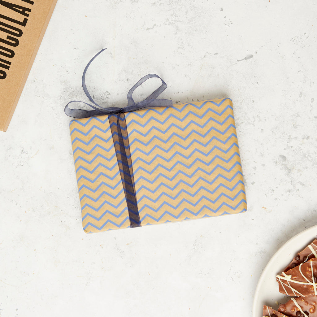 Our standard Bagstock & Bumble kraft gift wrap with a blue chevron design and blue ribbon. All our chocolates can be gift wrap and posted direct.