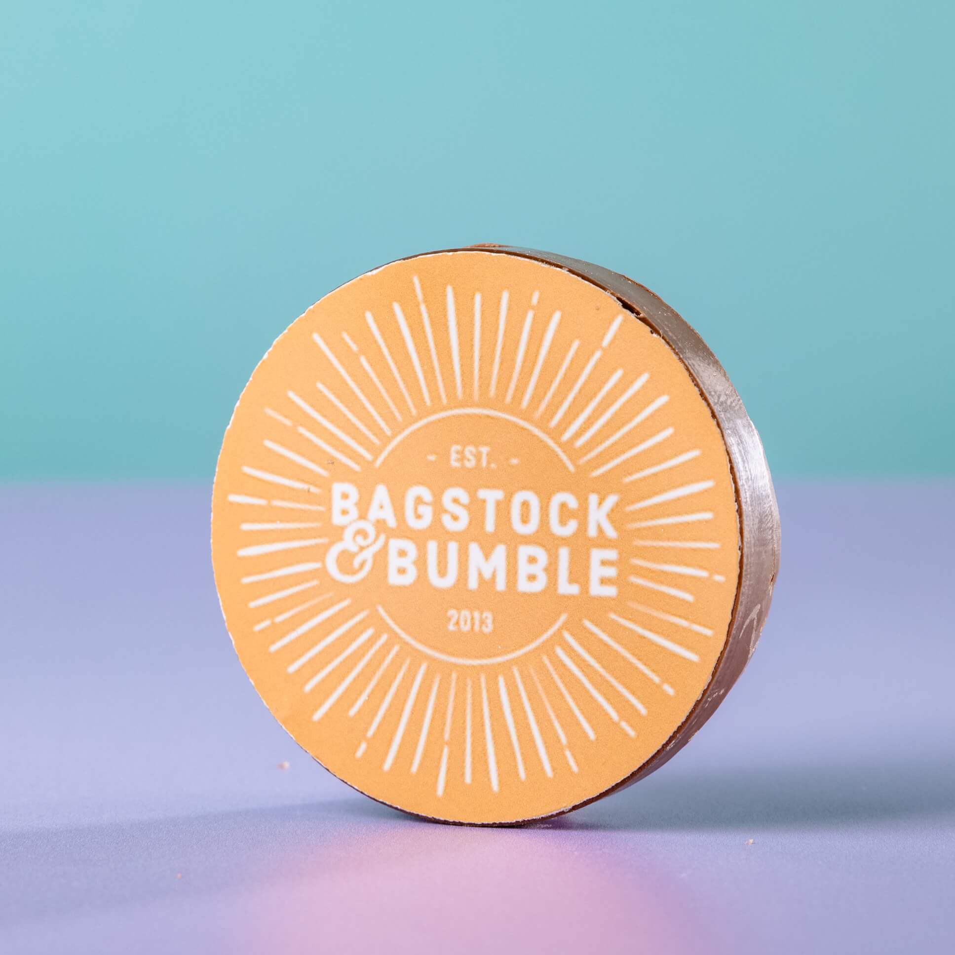Sample customised logo chocolate using the Bagstock & Bumble logo on a yellow background