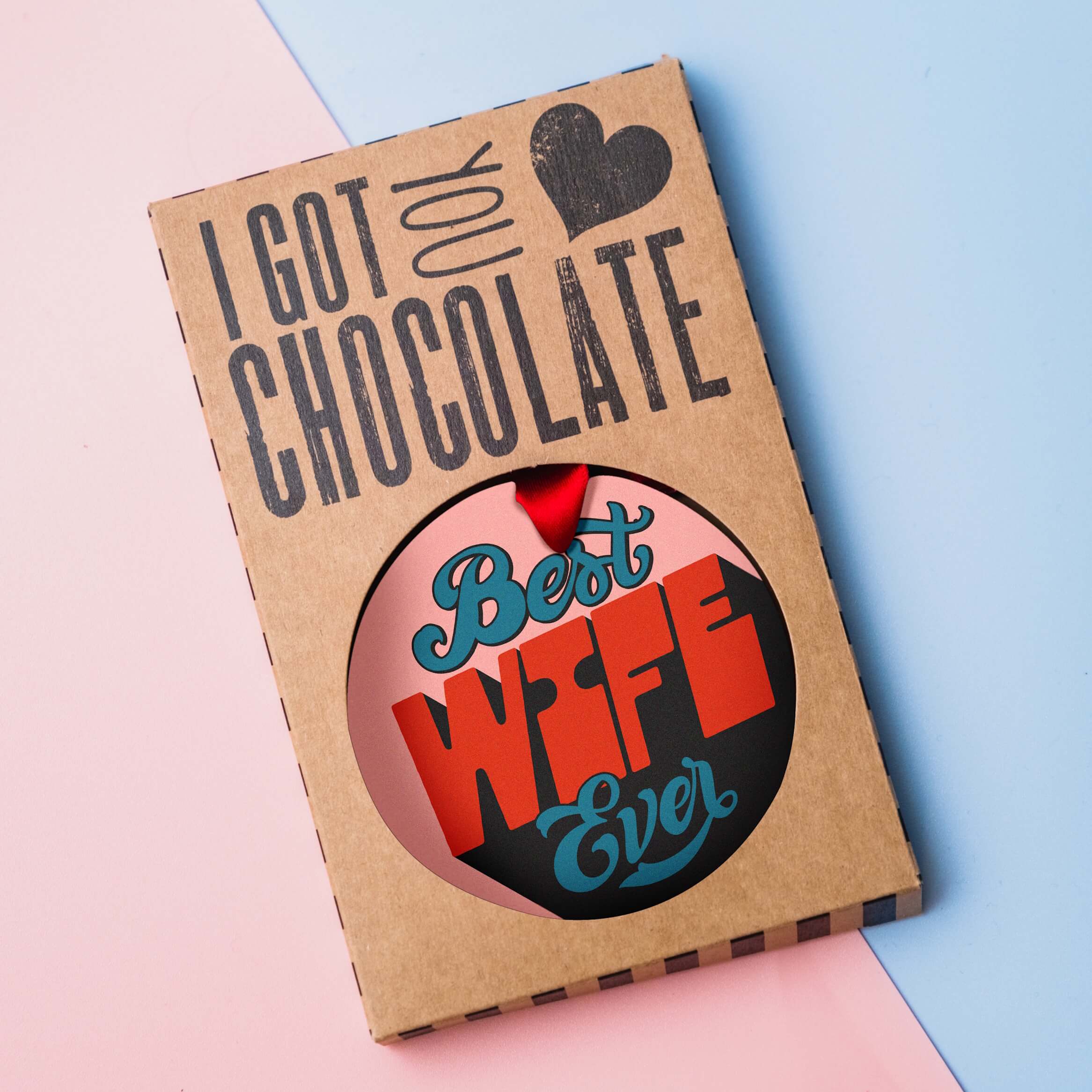 Best Wife Ever milk chocolate medal presented in plastic-free “I got you chocolate” gift packaging on a pastel background.
