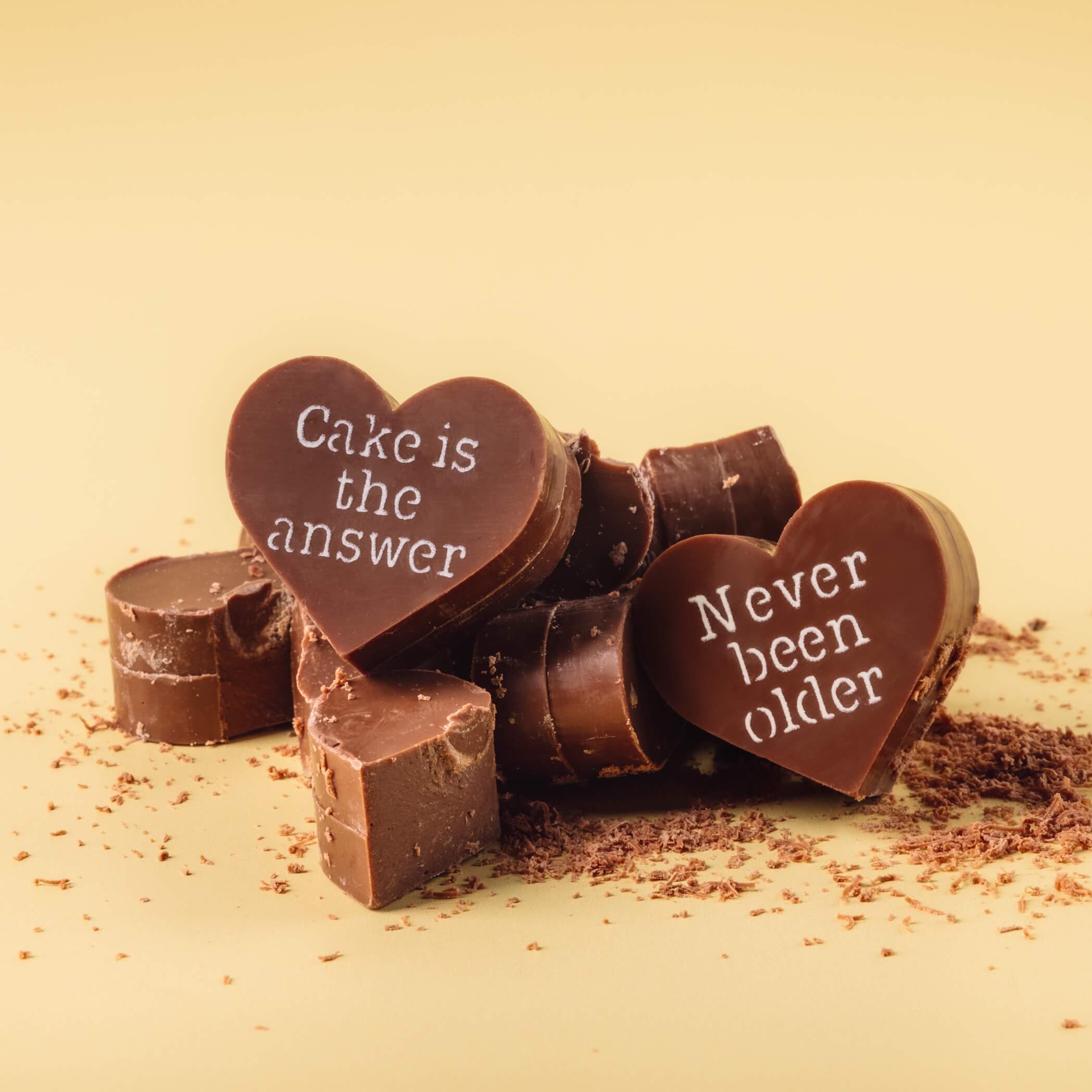 40th Birthday Chocolate ideas - Broken pieces of Bagstock & Bumble birthday chocolates highlighting the chunky Fairtrade milk chocolate inside – rich, indulgent and a little bit rude.