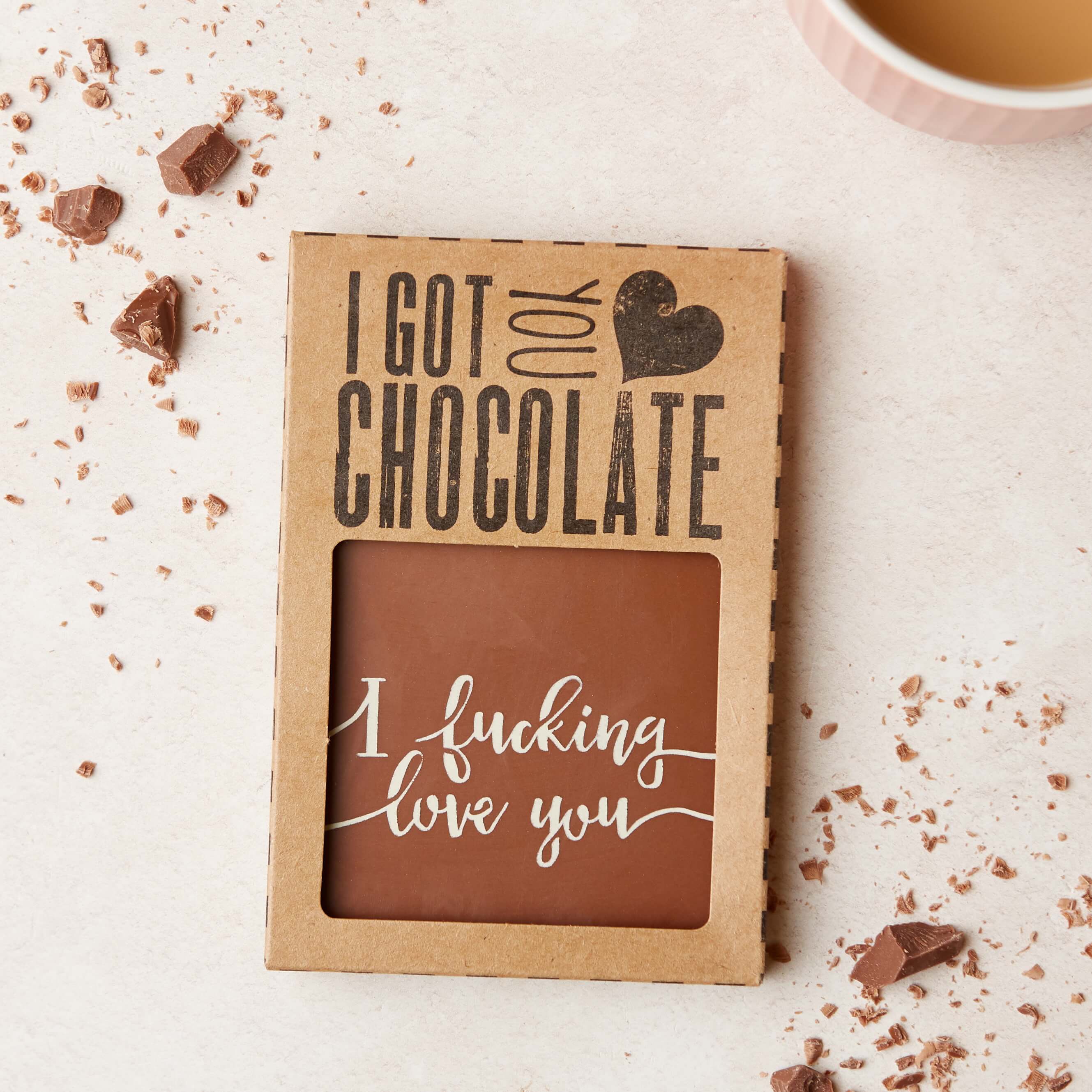 Chocolate gift for partners – A boxed chocolate bar with the message ‘I fucking love you’, shown through the window of our signature I Got You Chocolate packaging, ready to gift.