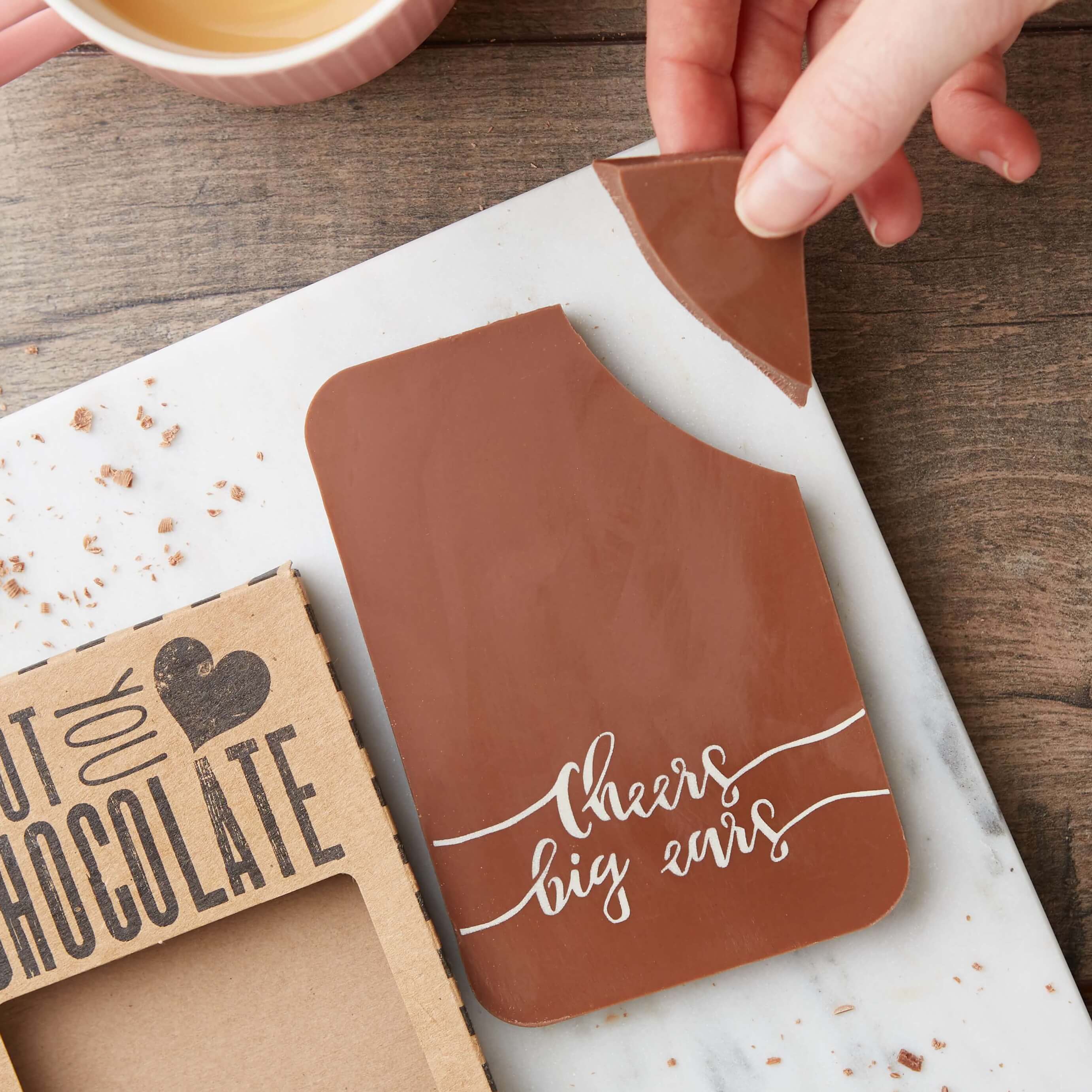 Chunky milk chocolate bar with ‘Cheers Big Ears’ message, mid-snap—perfect thank you chocolate for someone who deserves a treat.