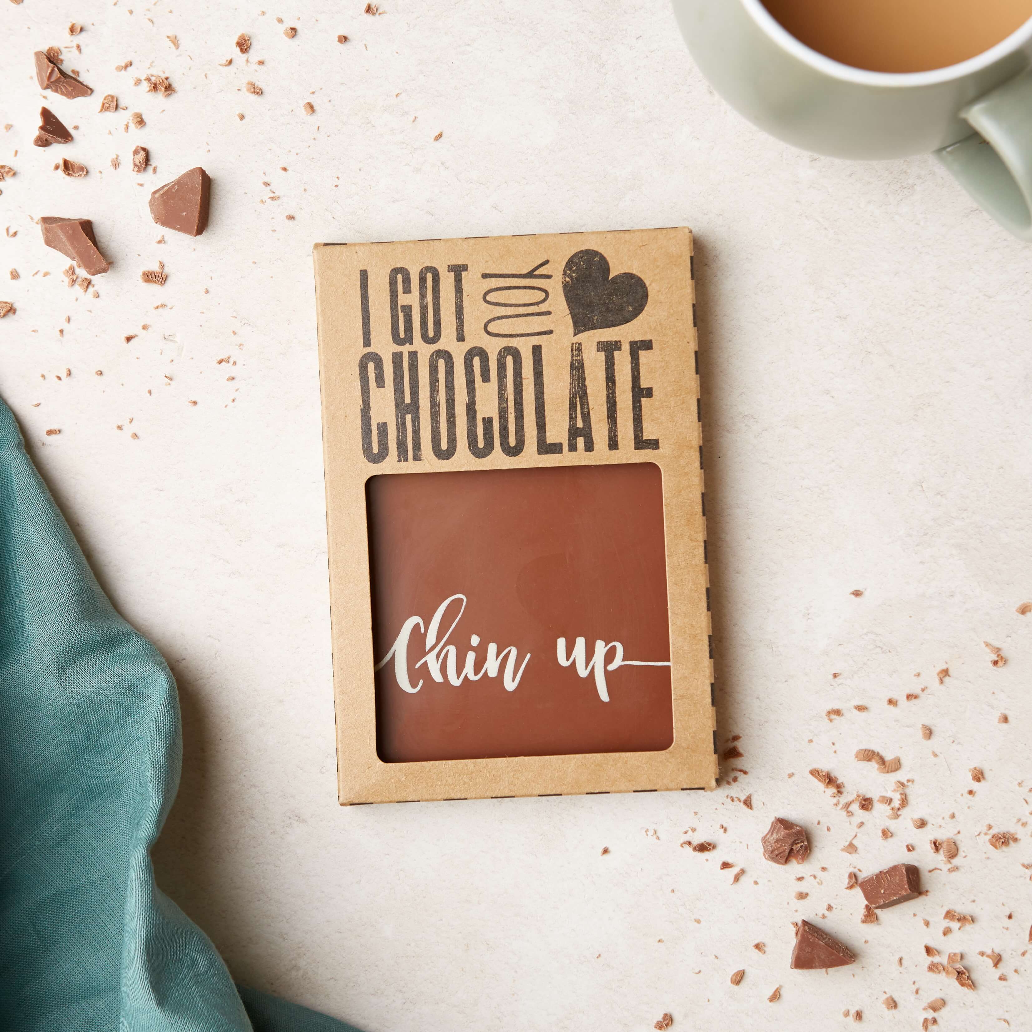 Gifts to Make Someone Smile - Our chocolate bar with a “Chin up” message, presented in it's kraft gift box that says “I got you chocolate”.