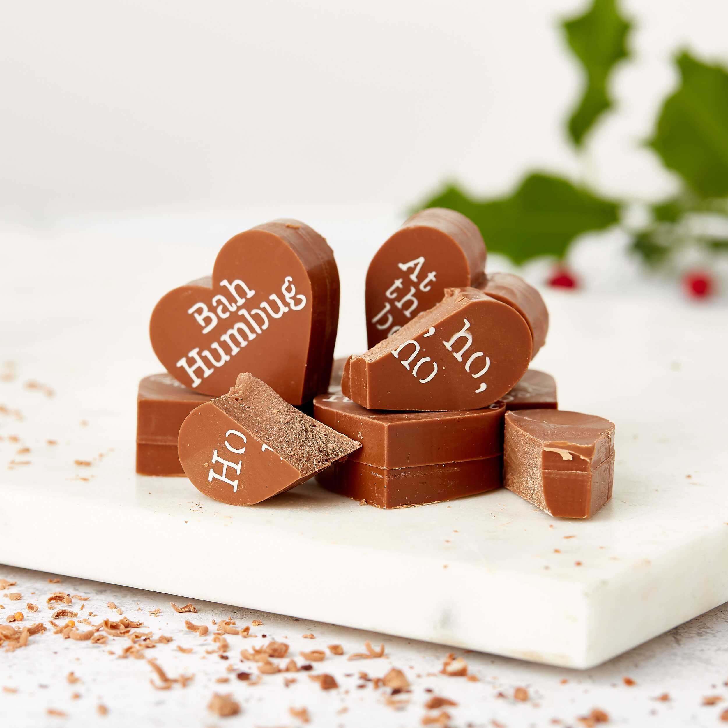 A pile of milk chocolate hearts decorated with grumpy festive phrases like “Ho, ho, no” and “Bah Humbug” – the ultimate funny Christmas chocolate for the merrily miserable.