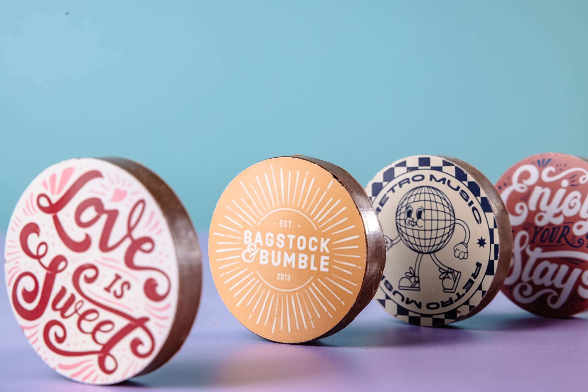A selection of branded corporate milk chocolate discs to show what we can achieve with our treats