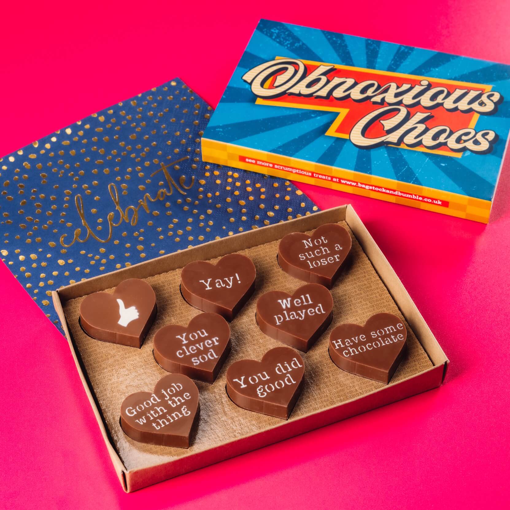 Congratulations Obnoxious Chocs from Bagstock & Bumble shown inside the box with bold vintage packaging, ready to hand straight to the lucky recipient.
