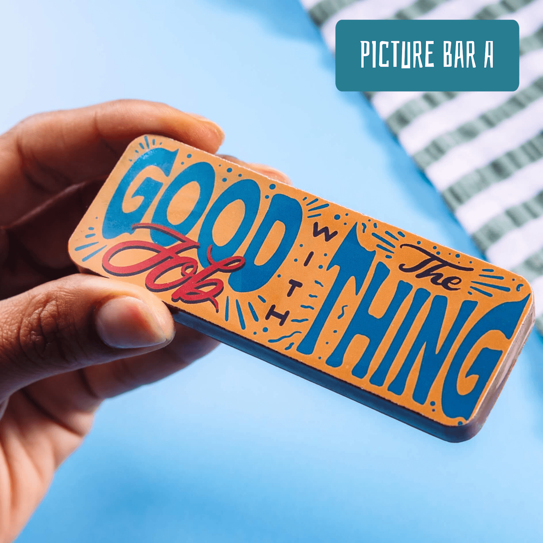 Close-up of a chocolate bar with colourful typography that reads “Good job with the thing” – brilliant as exam congratulations gifts and made with top quality Fairtrade Belgian chocolate.