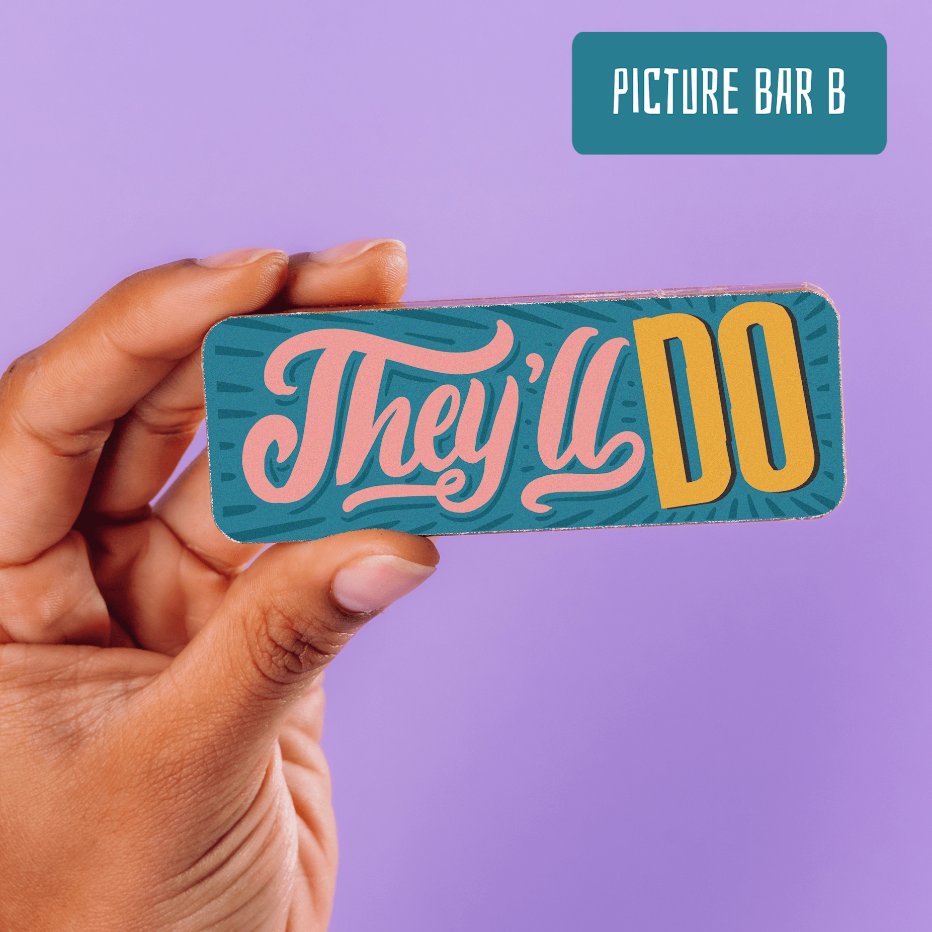 A hand holding a picture chocolate bar with the words “They’ll Do” in retro. A perfectly sarcastic addition to the Bagstock & Bumble engagement collection.