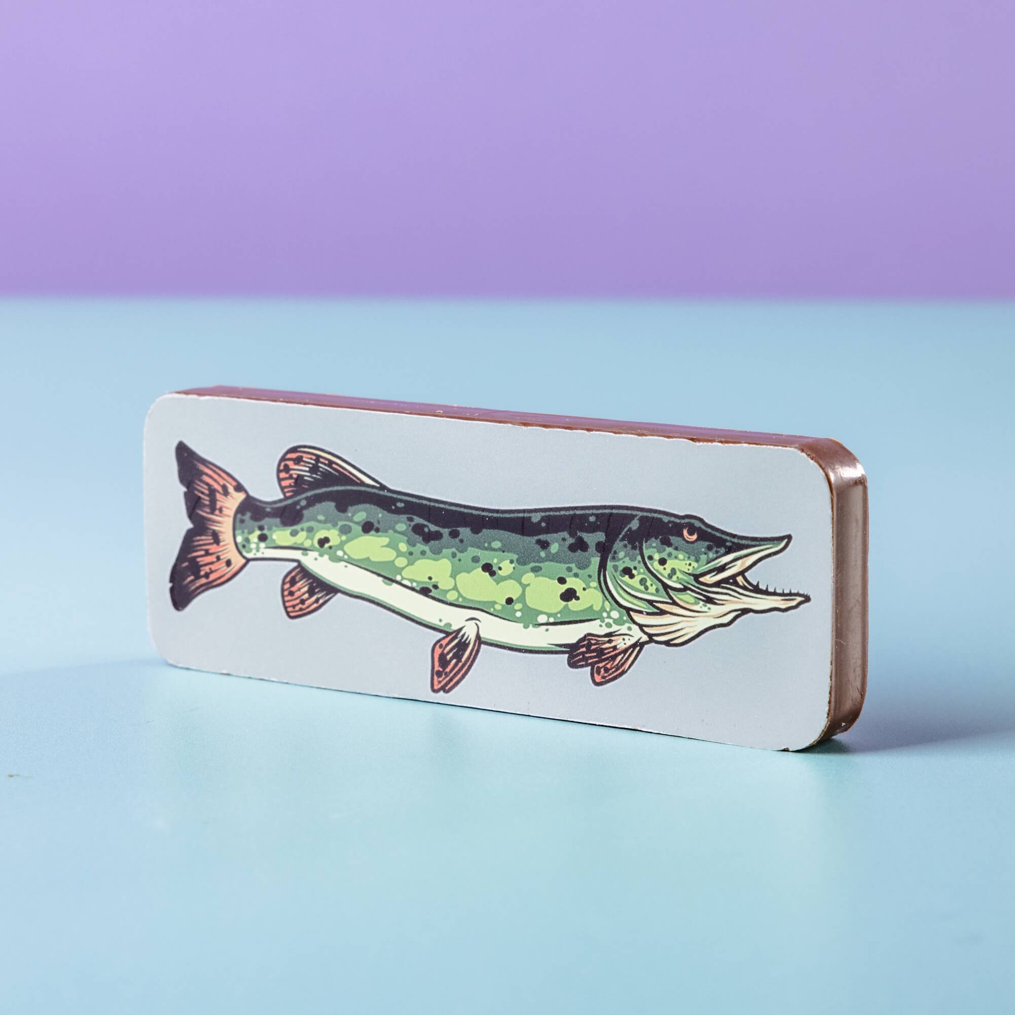 Chocolate bar with a fish illustration on a light blue background