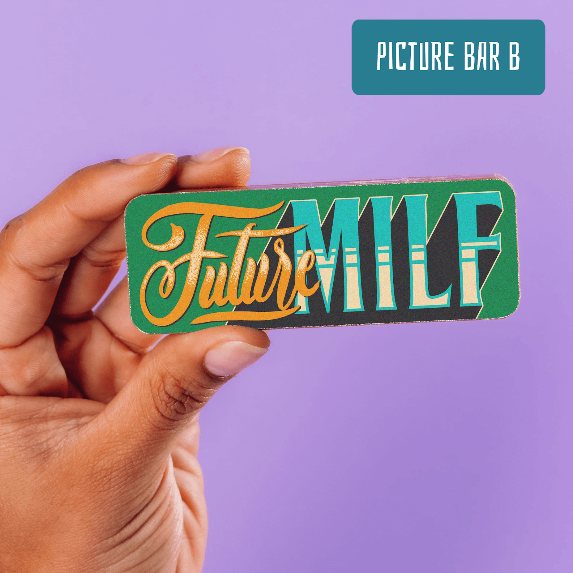A chocolate bar decorated with a 'Future MILF' slogan in retro typography being held up.  Part of the Pregnancy Chocolate Selection Box.