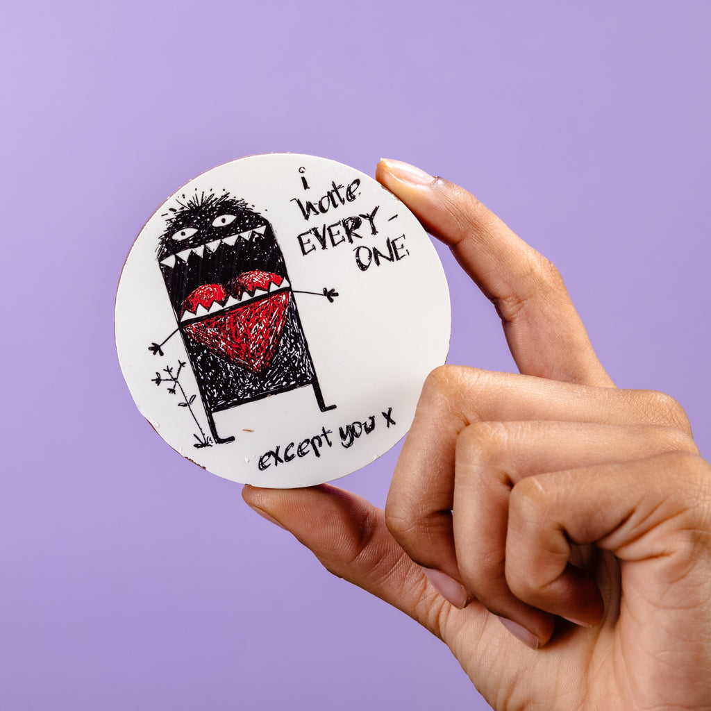 Hand holding the picture disc up to show the picture and cheeky message