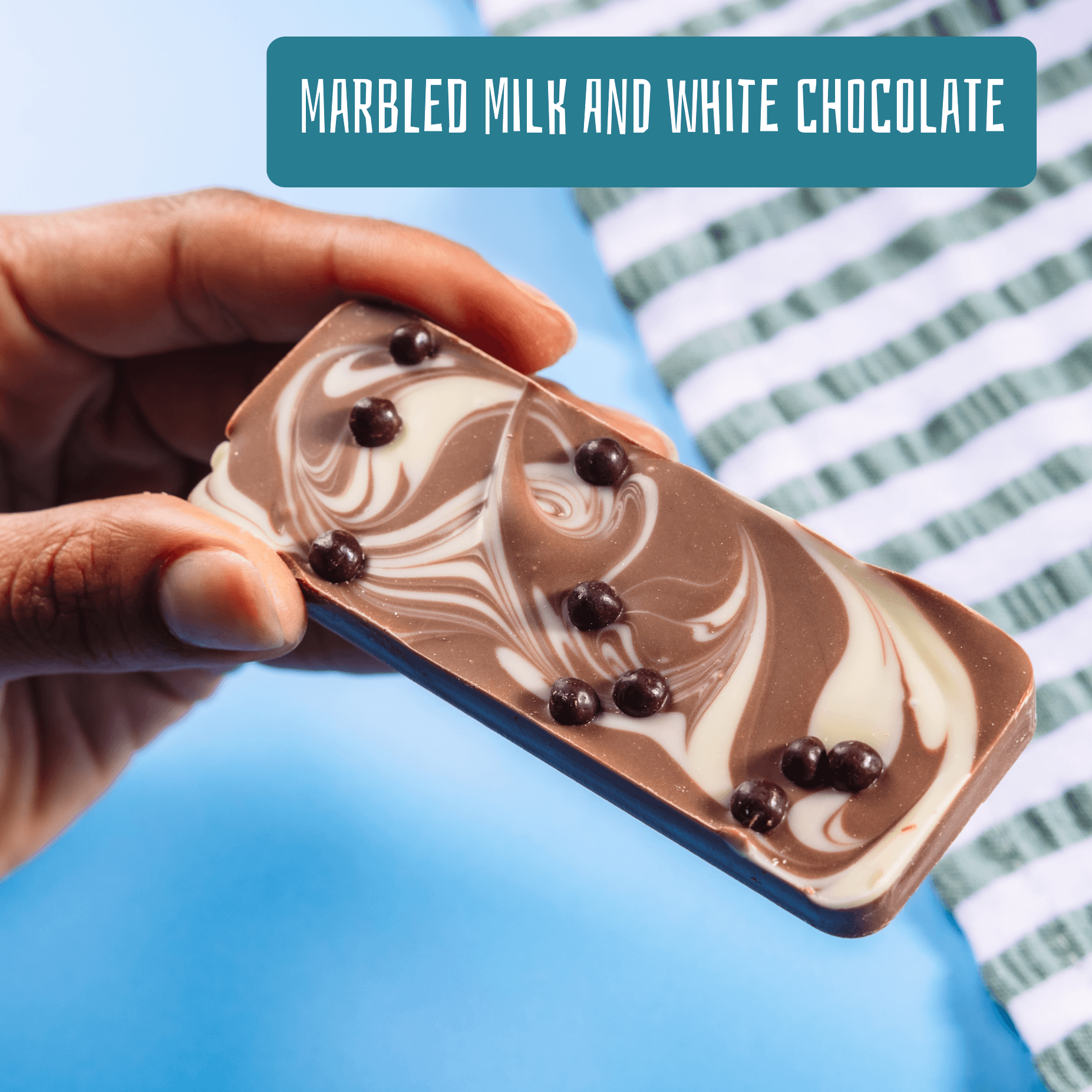 Fairtrade marbled milk and white chocolate bar topped with crispy dark chocolate balls