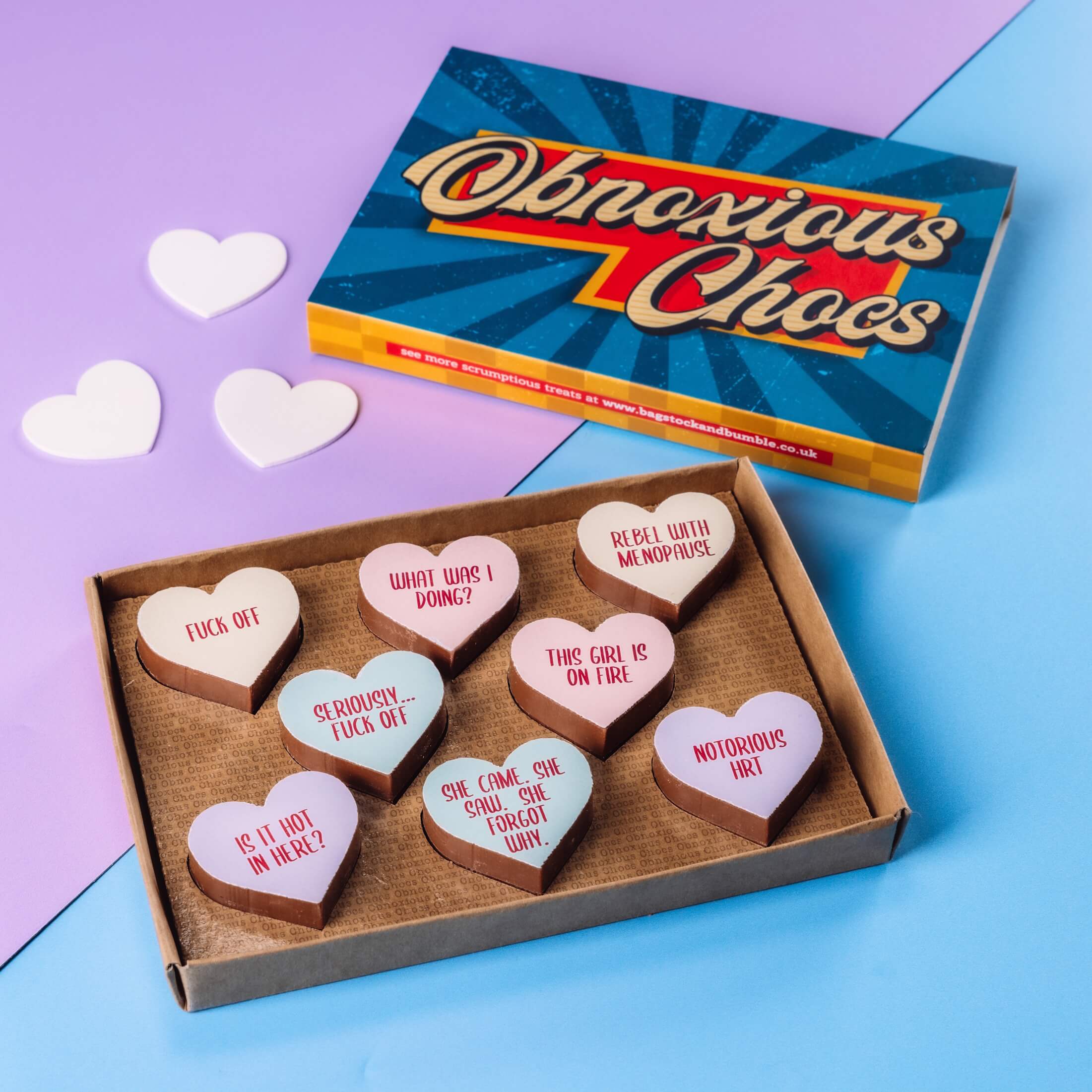 Menopause jokes from Bagstock & Bumble - Obnoxious Chocs in their gift box, shown next to colourful, retro-inspired packaging that's ready to hand straight over.