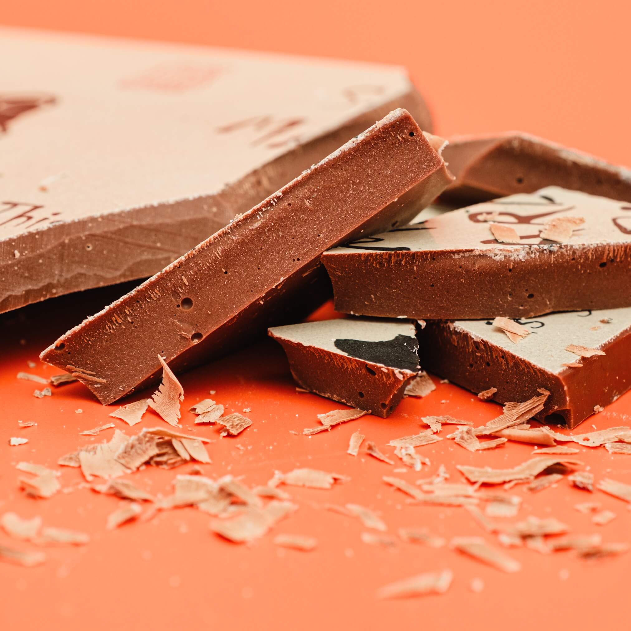 Easter Gifts for Adults UK - Close-up of thick fairtrade Belgian milk chocolate slab broken into pieces.