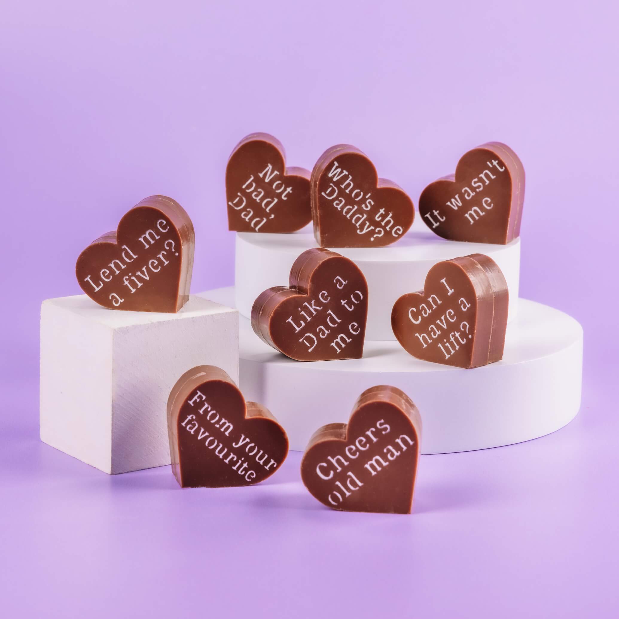 Funny Father's Day chocolate - chocolates on plinths, showing off slogans like 'Who’s the Daddy?' and 'Can I have a lift?'.