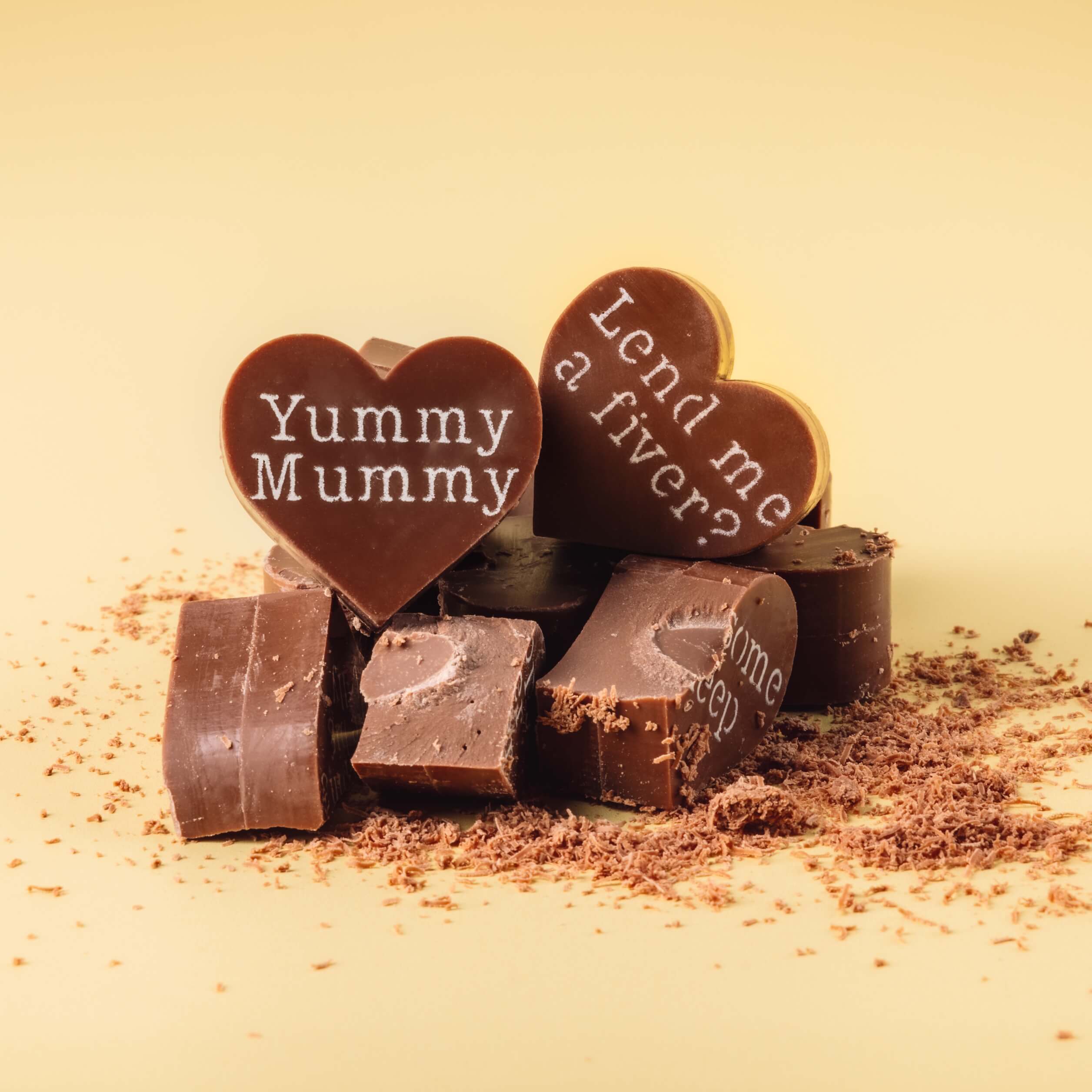 Sarcastic Presents for Mum - Broken chunks of Obnoxious Chocs showing off the thick, smooth Fairtrade Belgian milk chocolate inside – because Mums deserve the good stuff.