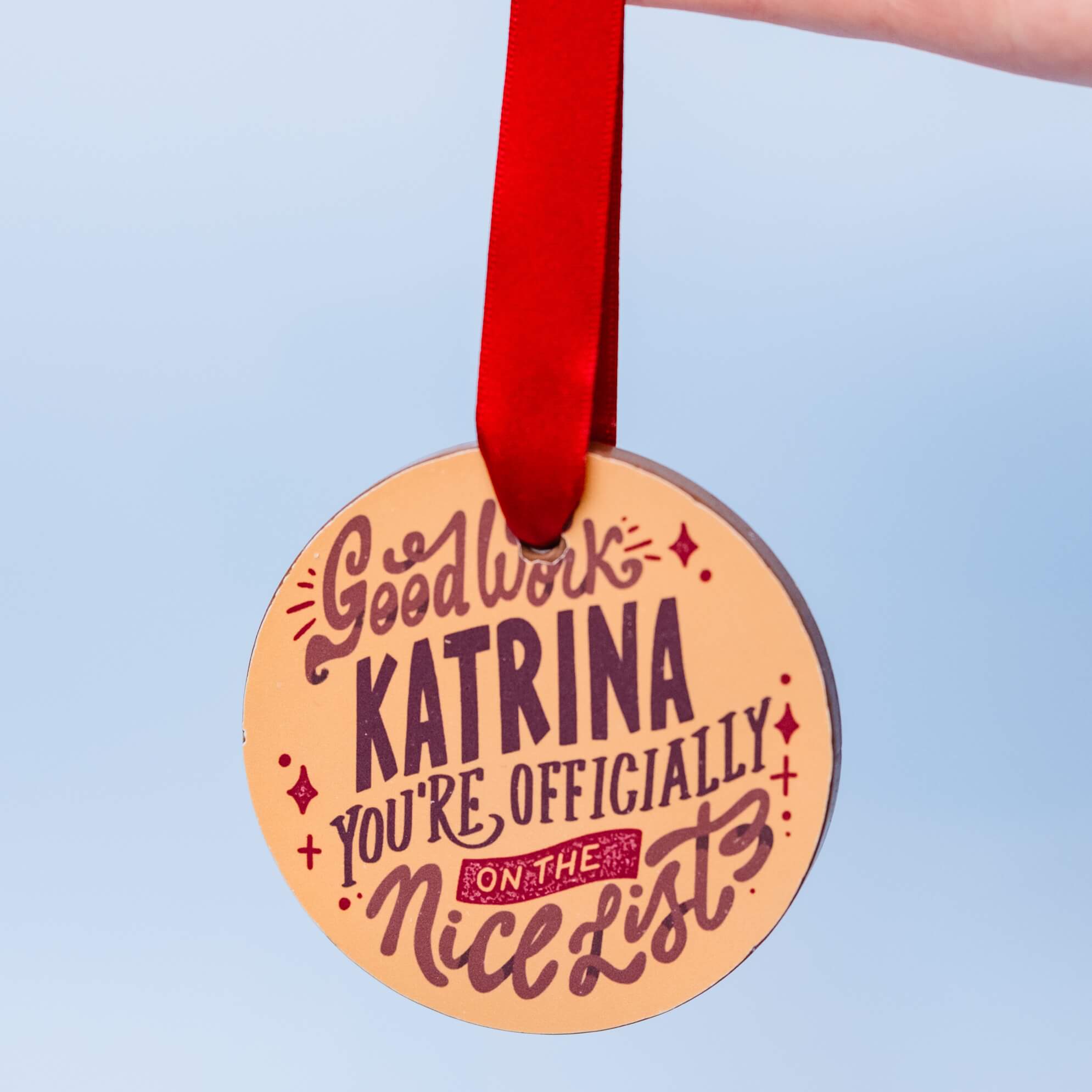 A 'You're officially on the nice list' chocolate medal personalised with a child's name
