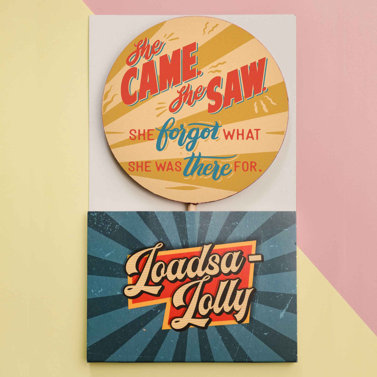 A chunky fairtrade chocolate lolly with a colourful transfer with the slogan ‘She came, she saw, she forgot what she was there for’ shown it it’s bespoke, ready-to-gift Loadsa-Lolly packaging