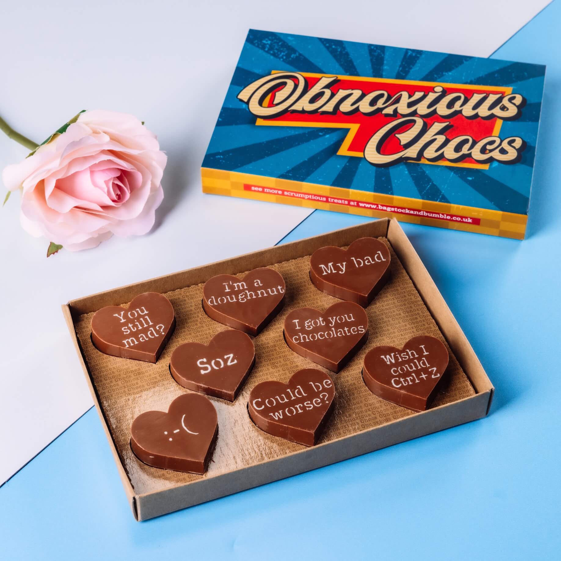 Sarcastic Apologies - Sorry Obnoxious Chocs from Bagstock & Bumble shown inside the box alongside bright, vintage packaging, made for gifting.