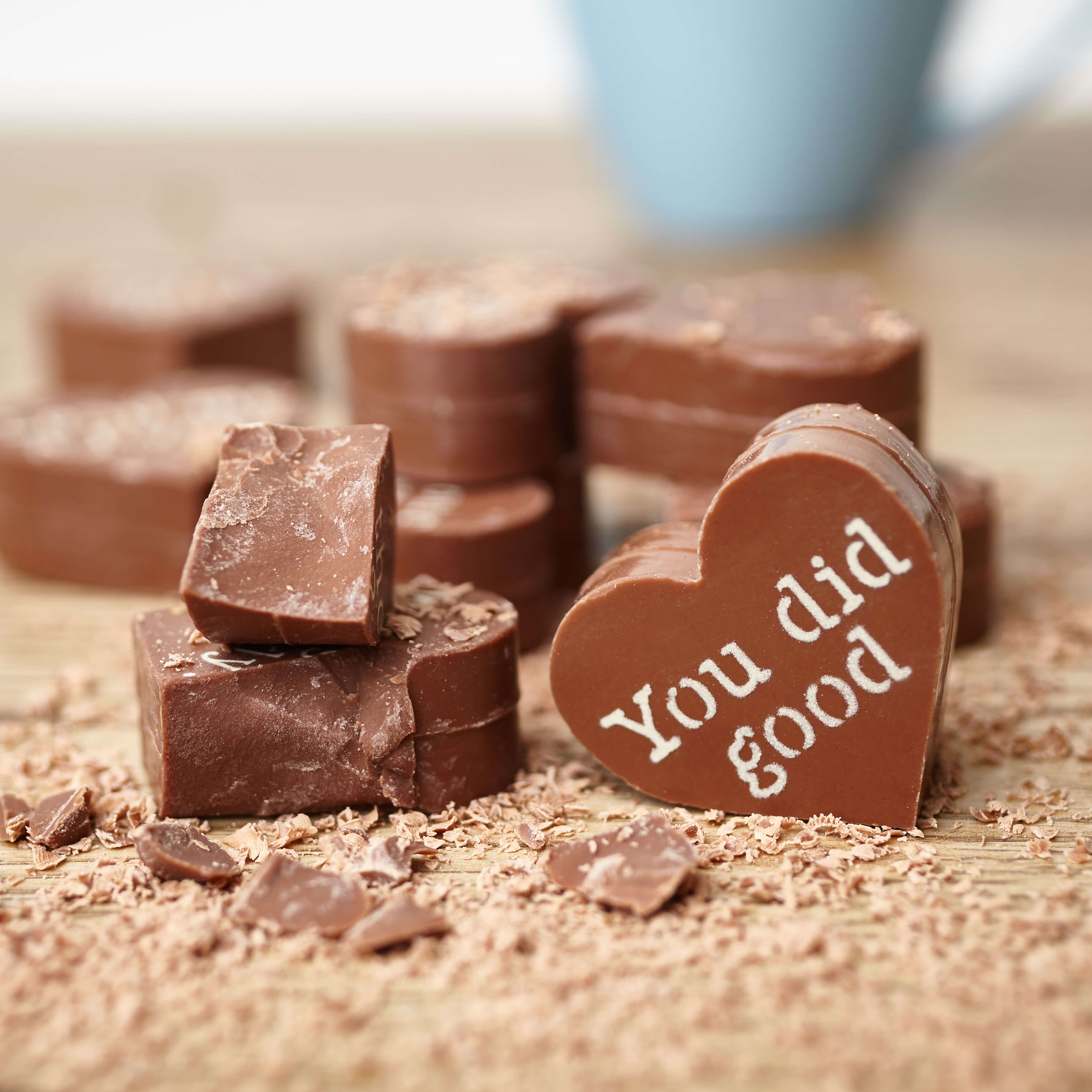 Thank You Chocolates by Post - Broken up Obnoxious Chocs showing off the thick, solid pieces of handmade milk chocolate with cheeky cocoa butter messages.