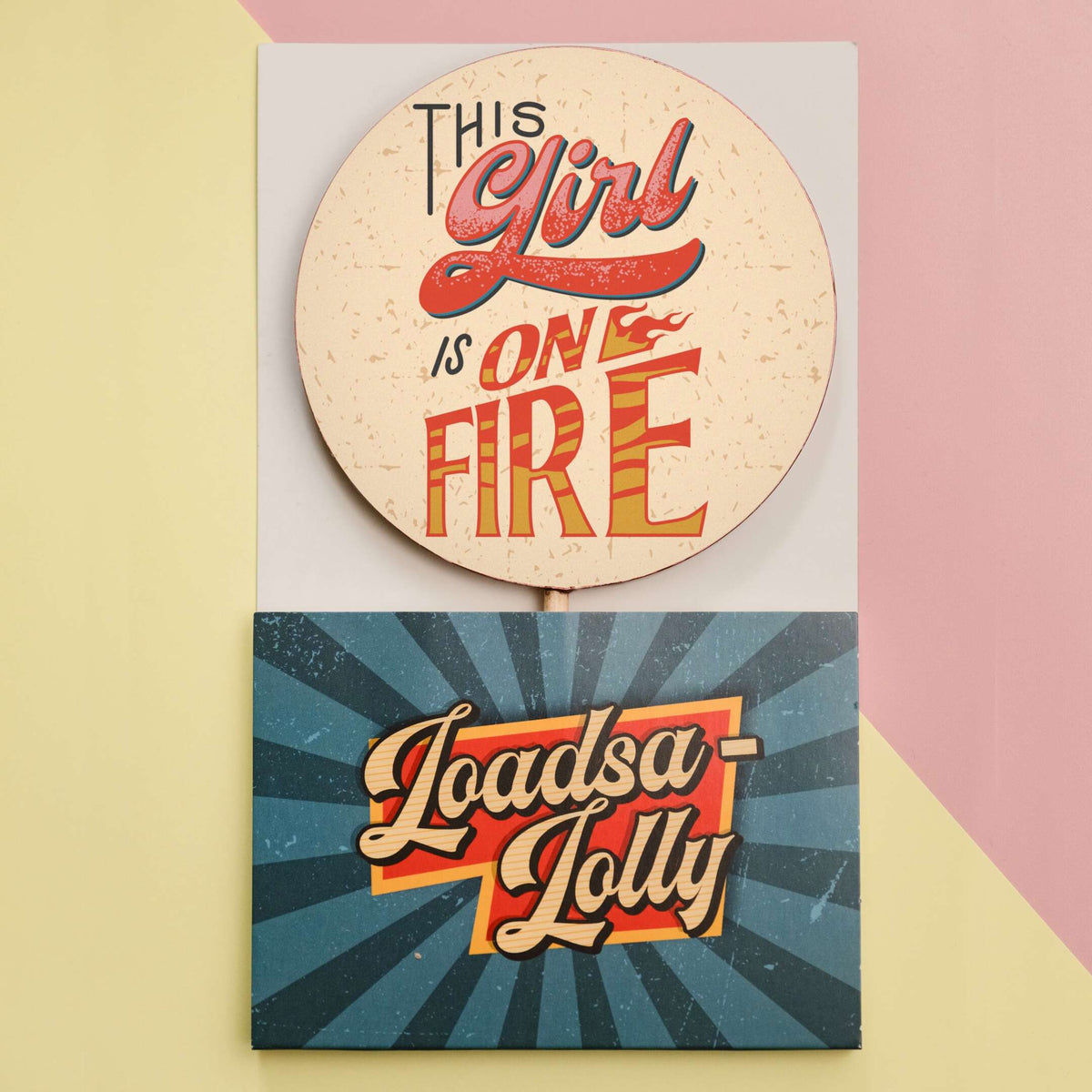 A chunky fairtrade chocolate lolly with a colourful transfer with the slogan ‘This girl is on fire’ shown it it’s custom, ready-to-gift Loadsa-Lolly packaging.