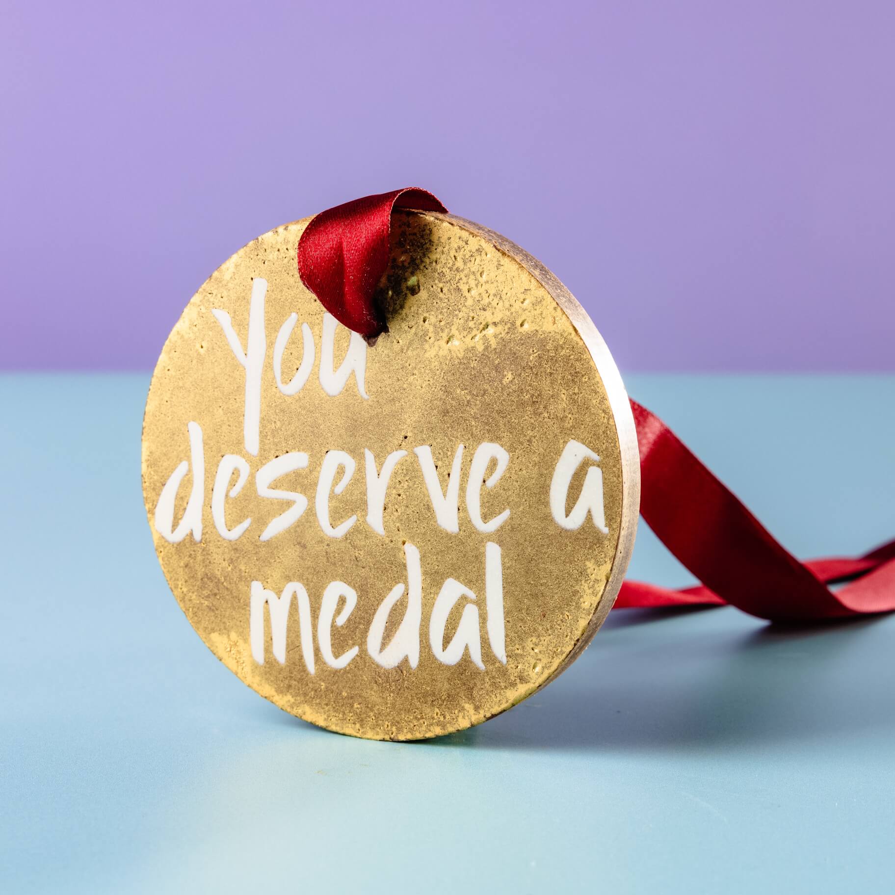Gold Medal Chocolate – A closer look at this scrumptious and shimmery edible treat, complete with a red ribbon for a wearable medal.