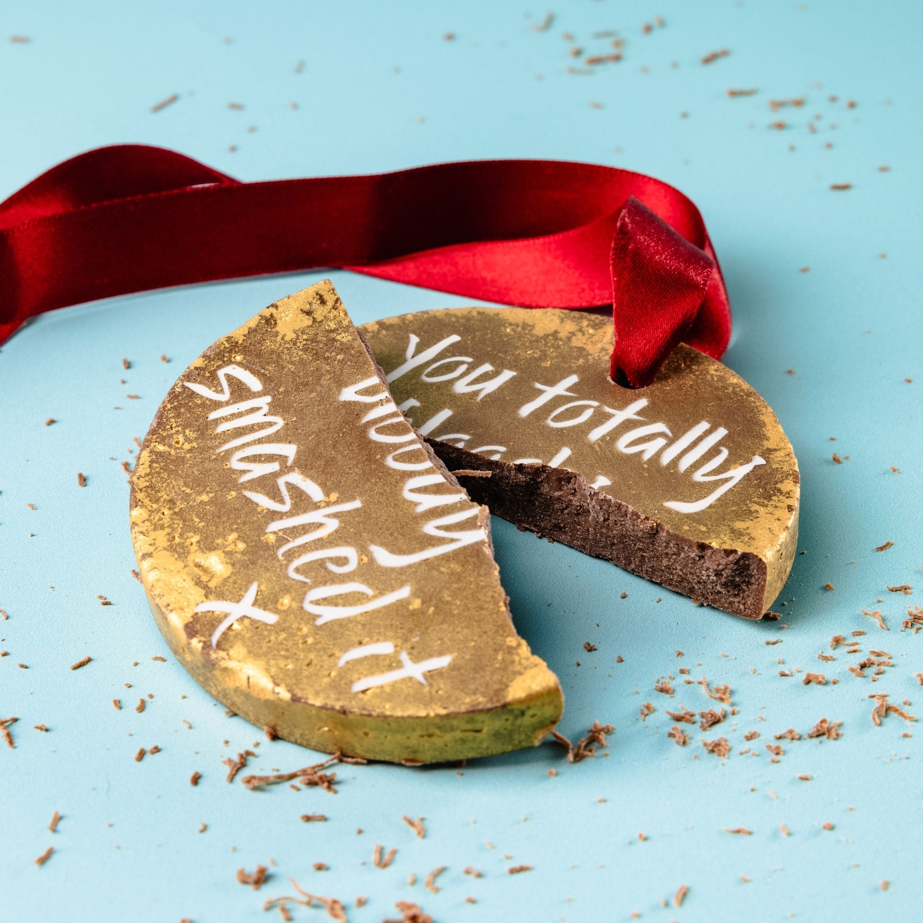 Solid Belgian chocolate medal, broken in half to show it's chunky milk chocolate centre. An exam congratulations that they can wear with pride and then enjoy with a cuppa. 