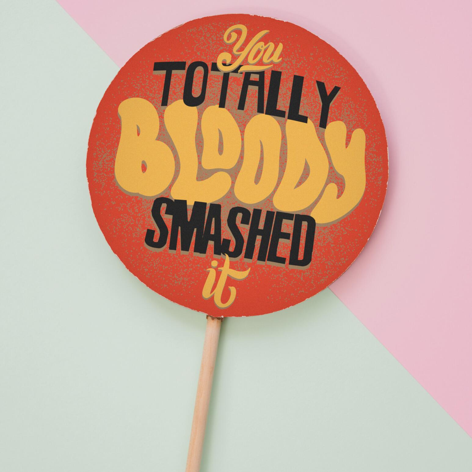 A delicious congratulations chocolate lolly shown on a pastel background