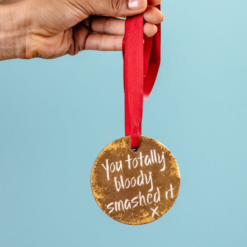 Gold chocolate medal with the message 'you totally bloody smashed it'... the perfect gift for a marathon runner