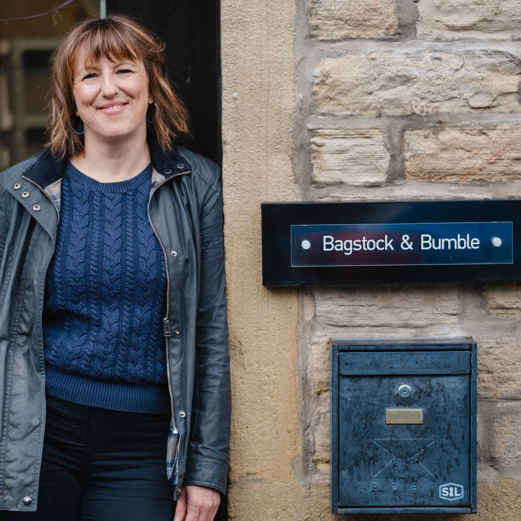 Katherine standing outside the workshop next to a 'Bagstock & Bumble' sign.