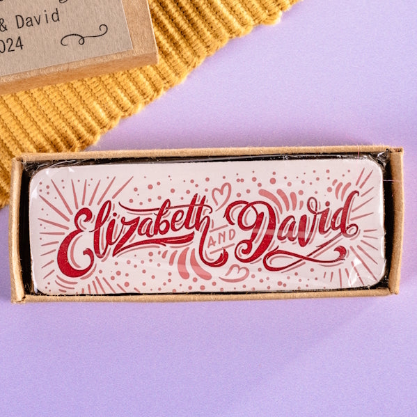 Matchbox style gift box containing a custom 'Elizabeth & David' chocolate bar.