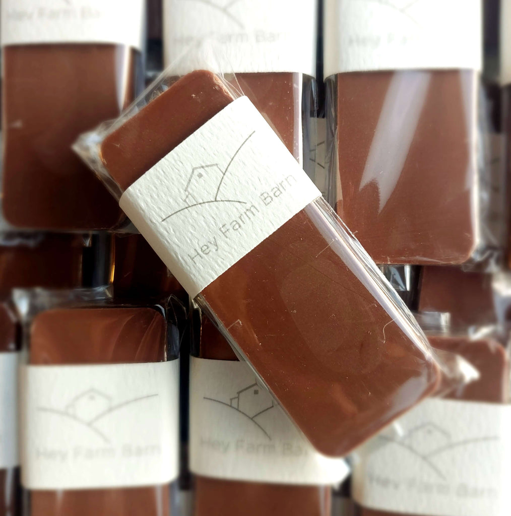 Chocolate bars in clear packaging with visible brand label against a blurred background