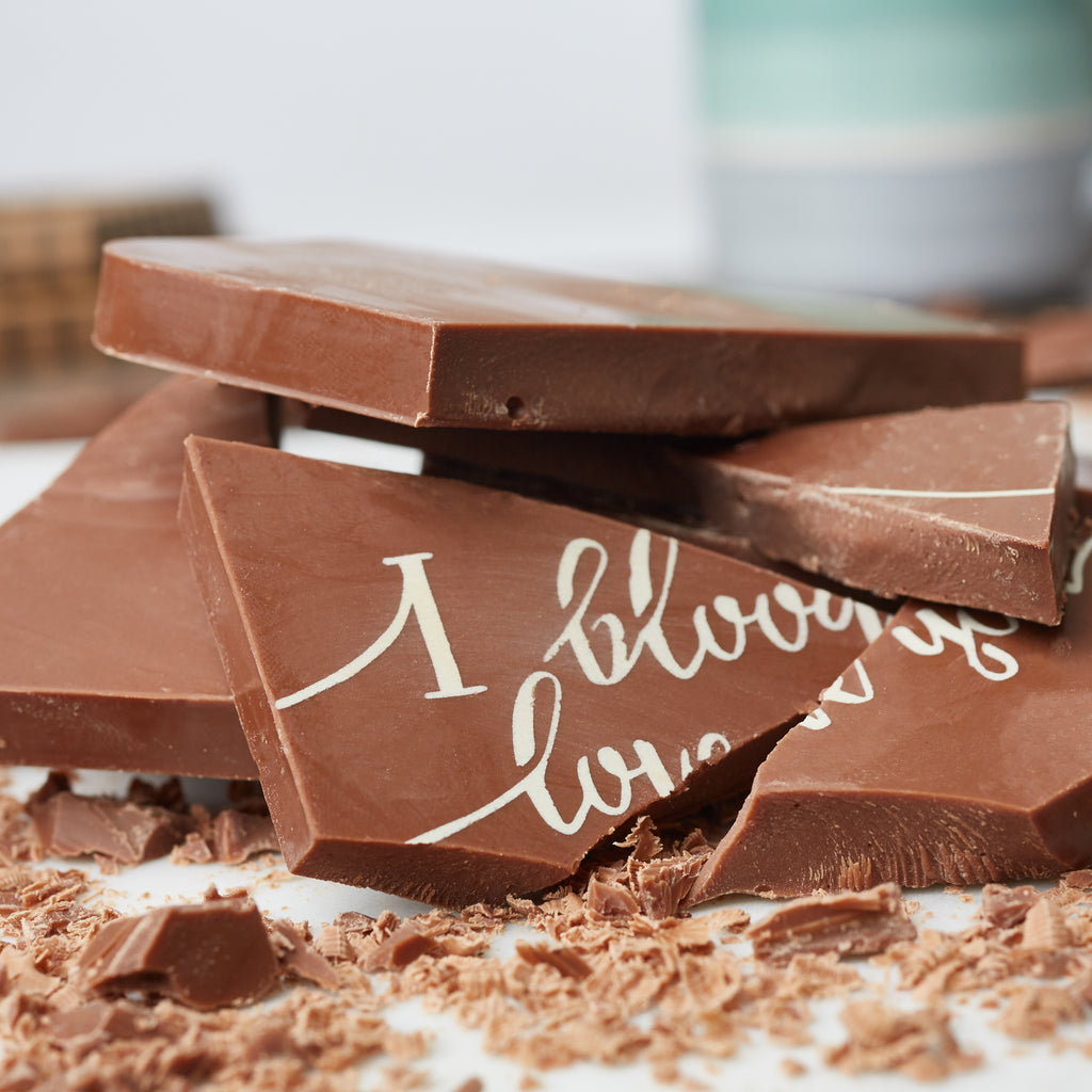 Belgian chocolate 'I bloody love you' bar, broken into pieces to show solid chunky centre