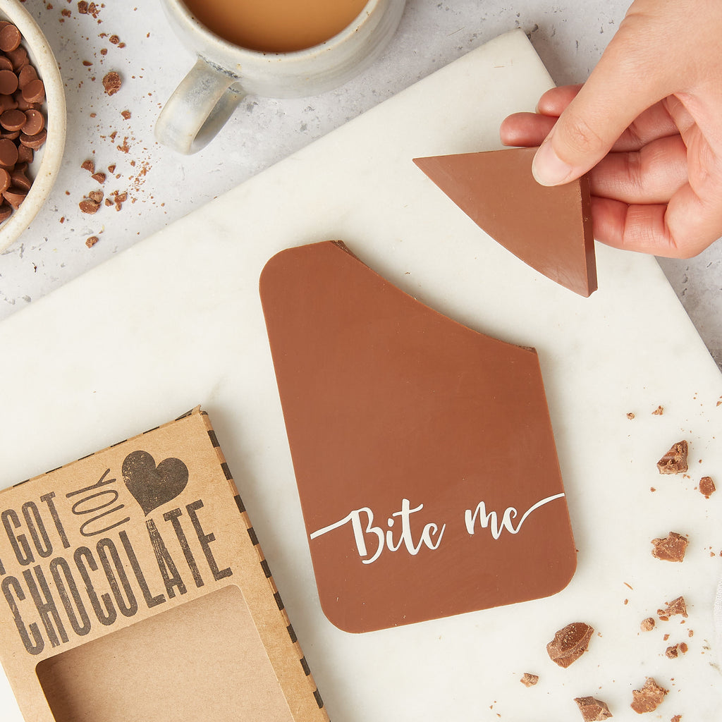 Flat lay view of 'Bite Me' milk chocolate bar out of packaging