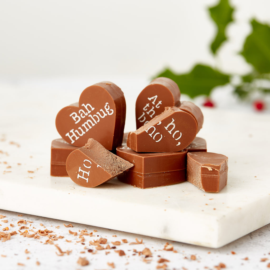 Funny chocolate stocking filler... a close up of the chunky Belgian milk chocolate hearts in the Christmas Obnoxious Chocs gift box.