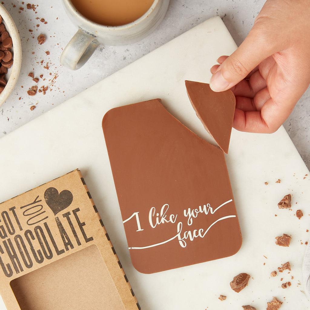 Chocolate bar made from Belgian milk chocolate and decorated with an 'I like your face' message